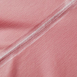 Close-up of pink fabric with a subtle texture